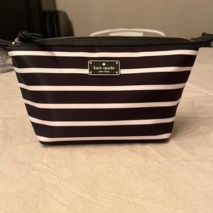 Kate Spade makeup Bag. Black and white stripes. Never used.